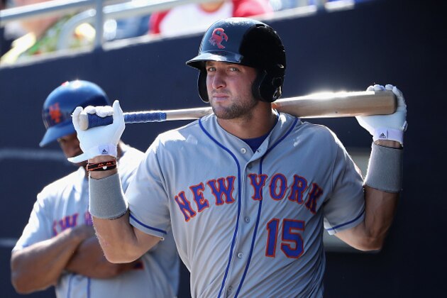 PEORIA, AZ - OCTOBER 13:  Tim Tebow #15 (New York Mets) of the Scottsdale Scorpions warms up in the dugout during the Arizona Fall League game against the Peoria Javelinas at Peoria Stadium on October 13, 2016 in Peoria, Arizona.  (Photo by Christian Petersen/Getty Images)