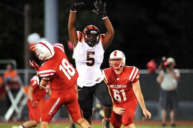 Defensive end Donovan Jeter (5) committed to Michigan on Sunday after decommitting from Notre Dame five days prior. Jeter was one of two athletes to flip in Michigan's favor, as Kwity Paye switched his pledge to Michigan from Boston College.