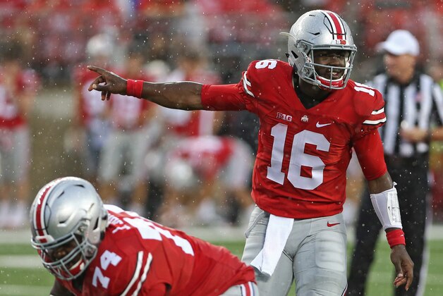 Sep 10, 2016; Columbus, OH, USA; Ohio State Buckeyes quarterback J.T. Barrett (16) calls out to his teammates prior to the snap in the second half against the Tulsa Golden Hurricane at Ohio Stadium. Ohio State won 48-3. Mandatory Credit: Aaron Doster-USA TODAY Sports