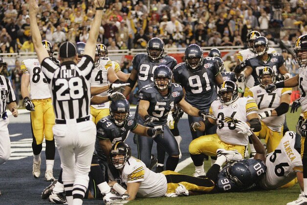 Steelers quarterback Ben Roethlisberger dives for the endzone during the matchup between the Steelers and the Seahawks for Super Bowl XL at Ford Field, in Detroit, Michigan on February 6th, 2006.  The Steelers won 21-10. (Photo by Larry Maurer/Getty Images)