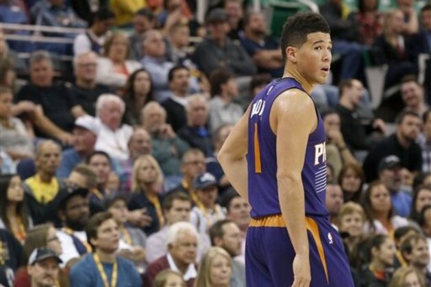 Phoenix Suns' Devin Booker (1) on the court during the first half of an NBA preseason basketball game against the Utah Jazz Wednesday, Oct. 12, 2016, in Salt Lake City. (AP Photo/Kim Raff)