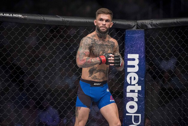 Aug 20, 2016; Las Vegas, NV, USA; Cody Garbrandt (red gloves) competes against Takeya Mizugaki (blue gloves) during UFC 202 at T-Mobile Arena. Mandatory Credit: Joshua Dahl-USA TODAY Sports