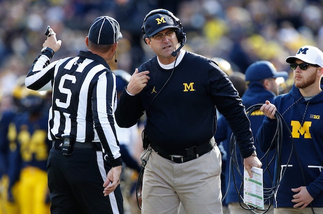 ANN ARBOR, MI - OCTOBER 22: Head coach Jim Harbaugh talks with a referee while playing the Illinois Fighting Illini on October 22, 2016 at Michigan Stadium in Ann Arbor, Michigan. (Michigan won the game 41-8. Photo by Gregory Shamus/Getty Images)