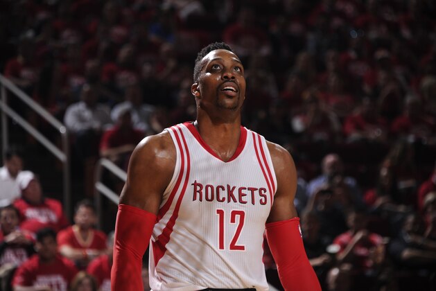 HOUSTON, TX - APRIL 21:  Dwight Howard #12 of the Houston Rockets looks on against the Golden State Warriors in Game Three of the Western Conference Quarterfinals during the 2016 NBA Playoffs on April 21, 2016 at the Toyota Center in Houston, Texas. NOTE TO USER: User expressly acknowledges and agrees that, by downloading and or using this photograph, User is consenting to the terms and conditions of the Getty Images License Agreement. Mandatory Copyright Notice: Copyright 2016 NBAE (Photo by Bill Baptist/NBAE via Getty Images)