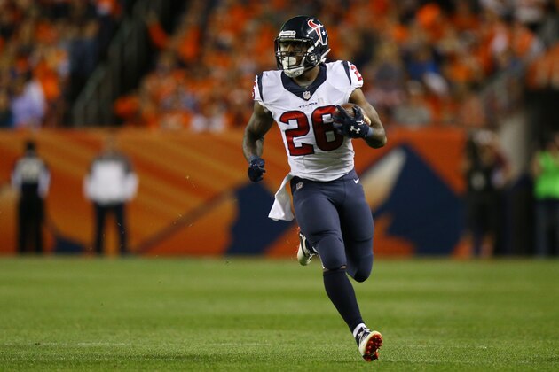 DENVER, CO - OCTOBER 24:  Running back Lamar Miller #26 of the Houston Texans rushes with the ball in the first quarter of the game against the Denver Broncos at Sports Authority Field at Mile High on October 24, 2016 in Denver, Colorado. (Photo by Justin Edmonds/Getty Images)
