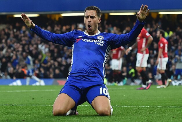Chelsea's Belgian midfielder Eden Hazard (C) celebrates after scoring their third goal during the English Premier League football match between Chelsea and Manchester United at Stamford Bridge in London on October 23, 2016. / AFP / GLYN KIRK / RESTRICTED TO EDITORIAL USE. No use with unauthorized audio, video, data, fixture lists, club/league logos or 'live' services. Online in-match use limited to 75 images, no video emulation. No use in betting, games or single club/league/player publications.  /         (Photo credit should read GLYN KIRK/AFP/Getty Images)