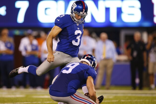 EAST RUTHERFORD, NJ - AUGUST 12: Kicker Josh Brown #3 of the New York Giants kicks a field goal as Brad Wing #9 holds against the Miami Dolphins during the first half of an NFL preseason game at MetLife Stadium on August 12, 2016 in East Rutherford, New Jersey. The Dolphins defeated the Giants 27-10. (Photo by Rich Schultz/Getty Images)