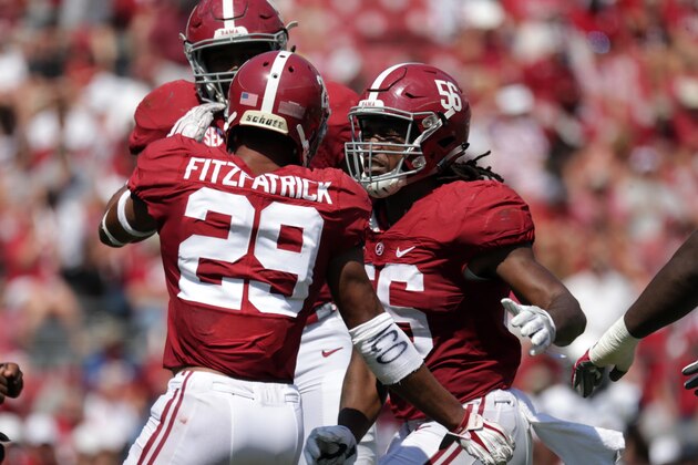 Sep 24, 2016; Tuscaloosa, AL, USA;  Alabama Crimson Tide linebacker Tim Williams (56) and defensive back Minkah Fitzpatrick (29) celebrate after tackling Kent State Golden Flashes quarterback Mylik Mitchell (not pictured) at Bryant-Denny Stadium. Mandatory Credit: Marvin Gentry-USA TODAY Sports