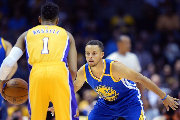 Oct 19, 2016; San Diego, CA, USA; Golden State Warriors guard Stephen Curry (30) defends Los Angeles Lakers guard D'Angelo Russell (1) during the first quarter at Valley View Casino Center. Mandatory Credit: Jake Roth-USA TODAY Sports