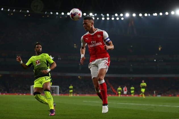 LONDON, ENGLAND - OCTOBER 25: Kieran Gibbs of Arsenal heads the ball clear during the EFL Cup fourth round match between Arsenal and Reading at Emirates Stadium on October 25, 2016 in London, England. (Photo by Catherine Ivill - AMA/Getty Images)