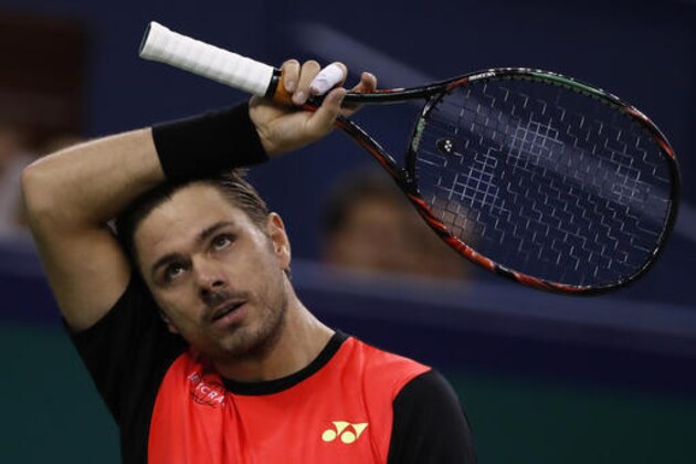 Stan Wawrinka of Switzerland reacts during the men's singles match against Giles Simon of France in the Shanghai Masters tennis tournament at Qizhong Forest Sports City Tennis Center in Shanghai, China, Thursday, Oct. 13, 2016. (AP Photo/Andy Wong)