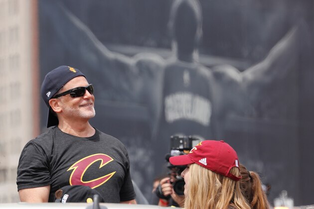 CLEVELAND, OH - JUNE 22:  Cleveland Cavaliers Owner Dan Gilbert waves at fans during the Cleveland Cavaliers Victory Parade And Rally on June 22, 2016 in downtown Cleveland, Ohio.  NOTE TO USER: User expressly acknowledges and agrees that, by downloading and/or using this Photograph, user is consenting to the terms and conditions of the Getty Images License Agreement. Mandatory Copyright Notice: Copyright 2016 NBAE  (Photo by Gregory Shamus/NBAE/Getty Images)