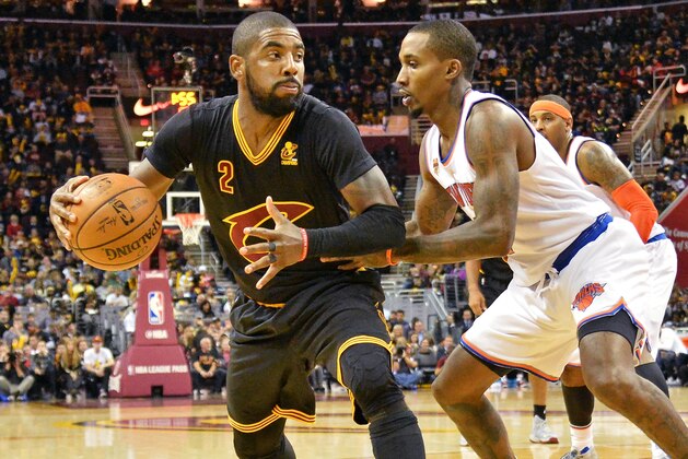 CLEVELAND, OH - OCTOBER 25:  Kyrie Irving #2 of the Cleveland Cavaliers is defended by Brandon Jennings #3 of the New York Knicks as he looks to the basket in the third quarter on October 25, 2016 at Quicken Loans Arena in Cleveland, Ohio. Cleveland defeated New York 117-88. NOTE TO USER: User expressly acknowledges and agrees that, by downloading and or using this photograph, User is consenting to the terms and conditions of the Getty Images License Agreement. (Photo by Jamie Sabau/Getty Images)