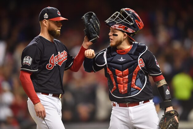 Oct 25, 2016; Cleveland, OH, USA; Cleveland Indians starting pitcher Corey Kluber (left) is greeted by catcher Roberto Perez after retiring the Chicago Cubs in the first inning in game one of the 2016 World Series at Progressive Field. Mandatory Credit: Ken Blaze-USA TODAY Sports