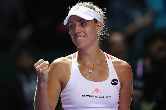 SINGAPORE - OCTOBER 25:  Angelique Kerber of Germany celebrates victory in her singles match against Simona Halep of Romania during day 3 of the BNP Paribas WTA Finals Singapore at Singapore Sports Hub on October 25, 2016 in Singapore.  (Photo by Julian Finney/Getty Images)