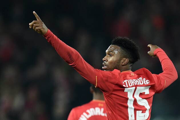 Liverpool's English striker Daniel Sturridge celebrates after scoring their second goal during the EFL (English Football League) Cup fourth round match between Liverpool and Tottenham Hotspur at Anfield in Liverpool north west England on October 25, 2016. / AFP / Oli SCARFF / RESTRICTED TO EDITORIAL USE. No use with unauthorized audio, video, data, fixture lists, club/league logos or 'live' services. Online in-match use limited to 75 images, no video emulation. No use in betting, games or single club/league/player publications.  /         (Photo credit should read OLI SCARFF/AFP/Getty Images)