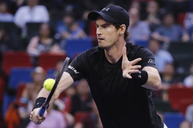 Andy Murray of Britain hits a return shot against Roberto Bautista Agut of Spain during the men's singles final of the Shanghai Masters tennis tournament at Qizhong Forest Sports City Tennis Center in Shanghai, China, Sunday, Oct. 16, 2016. (AP Photo/Andy Wong)