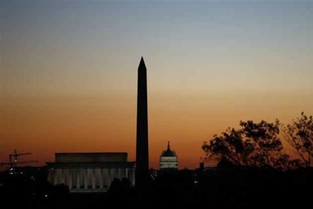 The Lincoln Memorial, left, Washington Monument, and U.S. Capitol are seen before the running of the 39th Marine Corps Marathon, Sunday, Oct. 26, 2014 in Arlington, Va. The race includes runners from 59 nations and each branch of the U.S. armed forces.  (AP Photo/Alex Brandon)