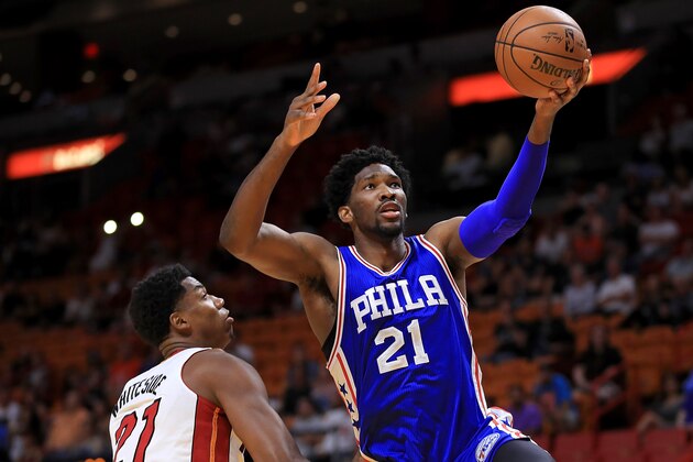 MIAMI, FL - OCTOBER 21:  Joel Embiid #21 of the Philadelphia 76ers drives on Hassan Whiteside #21 of the Miami Heat during a preseason game  at American Airlines Arena on October 21, 2016 in Miami, Florida.  (Photo by Mike Ehrmann/Getty Images)