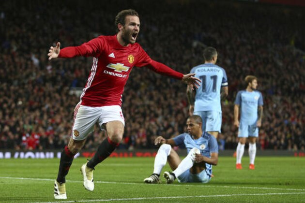 Manchester United's Juan Mata celebrates scoring a goal during the English League Cup soccer match between Manchester United and Manchester City at Old Trafford stadium in Manchester, England, Wednesday, Oct. 26, 2016. (AP Photo/Dave Thompson)