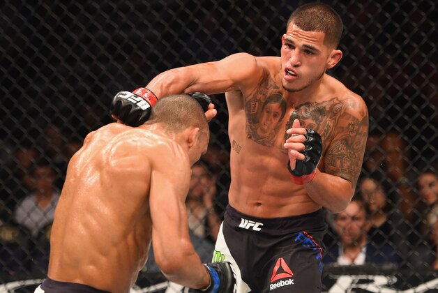 LAS VEGAS, NV - APRIL 23:  (R-L) Anthony Pettis punches Edson Barboza in their lightweight bout during the UFC 197 event inside MGM Grand Garden Arena on April 23, 2016 in Las Vegas, Nevada.  (Photo by Josh Hedges/Zuffa LLC/Zuffa LLC via Getty Images)