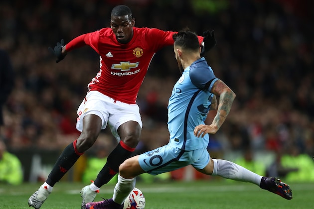 MANCHESTER, ENGLAND - OCTOBER 26: Paul Pogba of Manchester United (L) takes the ball past Nicolas Otamendi of Manchester City (R) during the EFL Cup fourth round match between Manchester United and Manchester City at Old Trafford on October 26, 2016 in Manchester, England.  (Photo by Michael Steele/Getty Images)