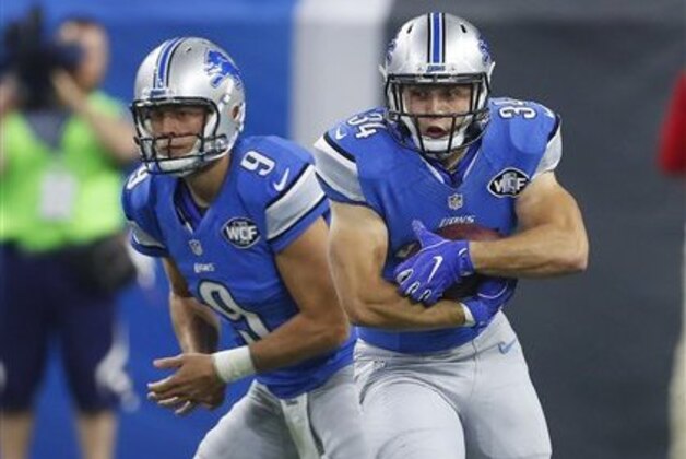 Detroit Lions fullback Zach Zenner (34) runs after a handoff from quarterback Matthew Stafford (9) during an NFL football game against the Washington Redskins in Detroit, Monday, Oct. 24, 2016. Detroit won 20-17. (AP Photo/Paul Sancya)