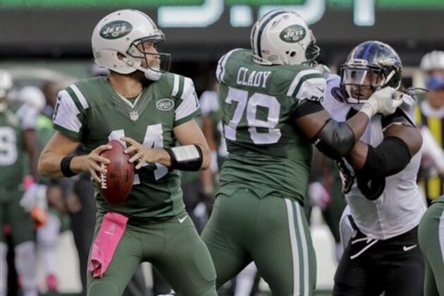 New York Jets quarterback Ryan Fitzpatrick (14) steps back to pass against the Baltimore Ravens during the fourth quarter of an NFL football game, Sunday, Oct. 23, 2016, in East Rutherford, N.J. (AP Photo/Frank Franklin II)