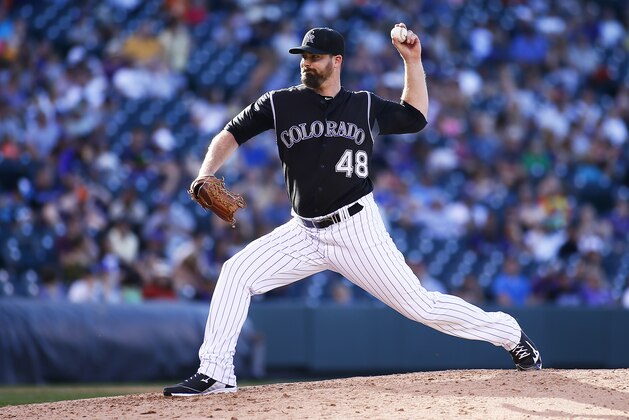 DENVER, CO - SEPTEMBER 18:  Boone Logan #48 of the Colorado Rockies pitches during a regular season MLB game between the Colorado Rockies and the visiting San Diego Padres at Coors Field on September 18, 2016 in Denver, Colorado.  (Photo by Russell Lansford/Getty Images)