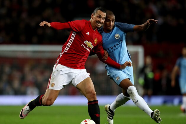 MANCHESTER, ENGLAND - OCTOBER 26:  Zlatan Ibrahimovic of Manchester United (L) and Fernando of Manchester City (R) battle for possession during the EFL Cup fourth round match between Manchester United and Manchester City at Old Trafford on October 26, 2016 in Manchester, England.  (Photo by David Rogers/Getty Images)