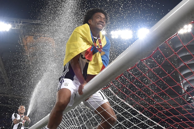 Juventus' forward from Colombia Juan Cuadrado celebrates after winning the Italian Tim Cup final football match AC Milan vs Juventus on May 21, 2016 at the Olympic Stadium in Rome.  Juventus won 0-1 in the extra time.     AFP PHOTO / TIZIANA FABI / AFP / TIZIANA FABI        (Photo credit should read TIZIANA FABI/AFP/Getty Images)