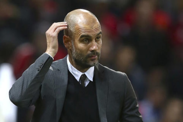 Manchester City's manager Pep Guardiola arrives pitch side ahead of the English League Cup soccer match between Manchester United and Manchester City at Old Trafford stadium in Manchester, England, Wednesday, Oct. 26, 2016. (AP Photo/Dave Thompson)