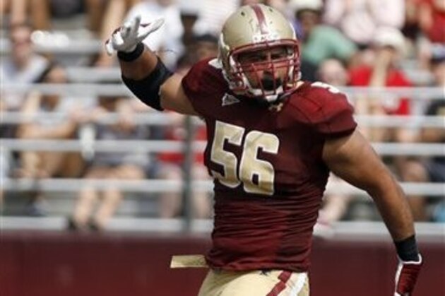 Boston College defensive end Max Holloway (56) celebrates a defensive play during the second half of an NCAA college football game against Northwestern, Saturday, Sept. 3, 2011, in Boston.  (AP Photo/Mary Schwalm)