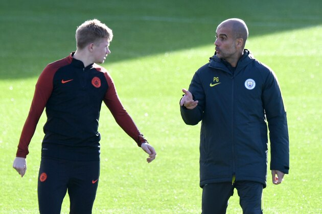 Manchester City's Spanish manager Pep Guardiola (R) talks with Manchester City's Belgian midfielder Kevin De Bruyne (L) during a team training session at Manchester City Football Academy Campus in Manchester, north west England, on October 18, 2016 ahead of their UEFA Champions League Group C football match against Barcelona at the Camp Nou on October 19.  / AFP / Anthony Devlin        (Photo credit should read ANTHONY DEVLIN/AFP/Getty Images)