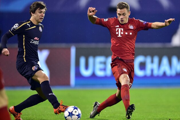 Dinamo Zagreb's midfielder Ante Coric (L) vies with Bayern Munich's midfielder Joshua Kimmich during the UEFA Champions League football match between Dinamo Zagreb v Bayern Munich at the Maksimir stadium in Zagreb on December 9, 2015. AFP PHOTO / ANDREJ ISAKOVIC / AFP / ANDREJ ISAKOVIC        (Photo credit should read ANDREJ ISAKOVIC/AFP/Getty Images)