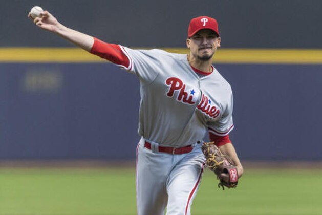 FILE - In this April 23, 2016 file photo, Philadelphia Phillies' Charlie Morton pitches to a Milwaukee Brewers batter during the first inning of a baseball game in Milwaukee. Philadelphia Phillies starting pitcher Charlie Morton is out for the season because of a torn left hamstring, Wednesday, April 27, 2016. (AP Photo/Tom Lynn, File)