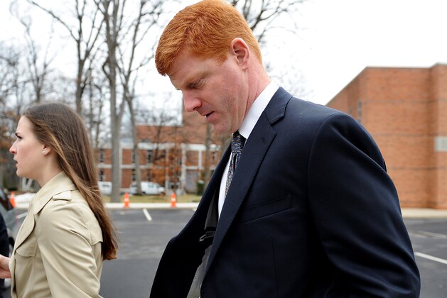STATE COLLEGE, PA - JANUARY 24: Former Penn State assistant coach Mike McQueary walks outside after paying respect to former Penn State Football coach Joe Paterno during a public viewing at the Pasquerilla Spiritual Center on the campus of Penn State on January 24, 2012 in State College, Pennsylvania. Paterno, who was 85, died due to complications from lung cancer on January 22, 2012. (Photo by Patrick Smith/Getty Images)