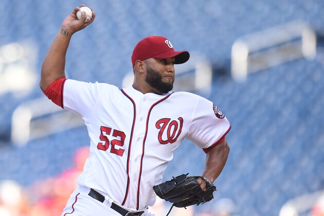 WASHINGTON, DC - AUGUST 27:  Yusmeiro Petit #52 of the Washington Nationals pitches during a baseball game against the Colorado Rockies at Nationals Park on August 27, 2016 in Washington, DC.  The Rockies won 9-4 in 11 innings.  (Photo by Mitchell Layton/Getty Images)