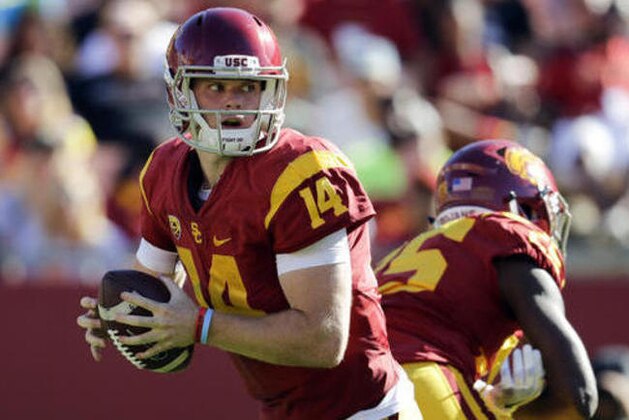 FILE - In this Saturday, Oct. 8, 2016, file photo, Southern California quarterback Sam Darnold looks to pass during the second half of an NCAA college football game against Colorado in Los Angeles.  The Trojans will attempt to build on their three-game winning streak Thursday night at the Coliseum against weary California, which had a short week to prepare for the Pac-12 showdown. (AP Photo/Jae C. Hong, File)