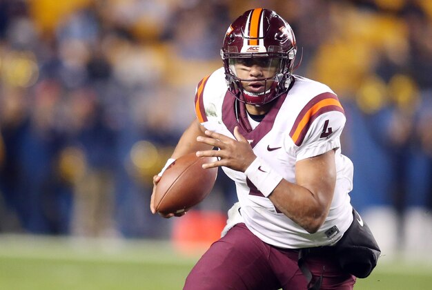 Oct 27, 2016; Pittsburgh, PA, USA;  Virginia Tech Hokies quarterback Jerod Evans (4) scrambles with the ball against the Pittsburgh Panthers during the first half at Heinz Field. Mandatory Credit: Charles LeClaire-USA TODAY Sports