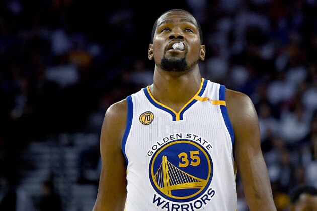 OAKLAND, CA - OCTOBER 25:  Kevin Durant #35 of the Golden State Warriors looks on against the San Antonio Spurs during the third quarter in an NBA basketball game at ORACLE Arena on October 25, 2016 Oakland, California. NOTE TO USER: User expressly acknowledges and agrees that, by downloading and or using this photograph, User is consenting to the terms and conditions of the Getty Images License Agreement.  (Photo by Thearon W. Henderson/Getty Images)