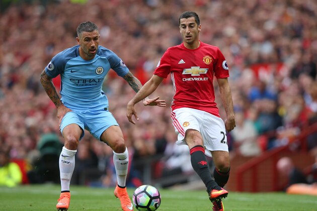 MANCHESTER, ENGLAND - SEPTEMBER 10:  Henrikh Mkhitaryan of Manchester United (R) takes the ball past Aleksander Kolorov of Manchester City (L) during the Premier League match between Manchester United and Manchester City at Old Trafford on September 10, 2016 in Manchester, England.  (Photo by Alex Livesey/Getty Images)