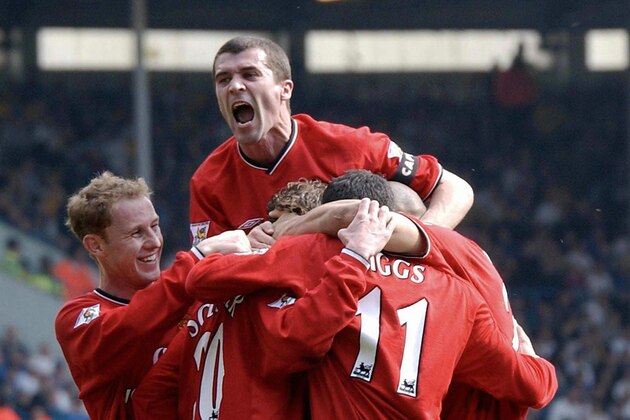 LEEDS, United Kingdom:  (FILES) Manchester United captain Roy Keane (C) celebrates with team-mates after their first goal against Leeds during their premiereship soccer clash at Leeds in this 30 March 2002 file picture. Keane left Manchester United on Friday, after more than 12 years at the Club. AFP PHOTO/FILES/PAUL BARKER  (Photo credit should read PAUL BARKER/AFP/Getty Images)