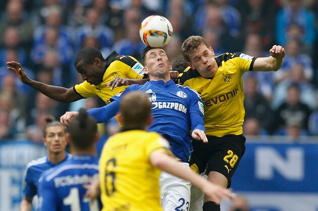 GELSENKIRCHEN, NORTH RHINE-WESTPHALIA - APRIL 10:  Pierre-Emile Hojbjerg (C) of FC Schalke 04 jumps for a header with Adrian Ramos (L) and Matthias Ginter of Borussia Dortmund during the Bundesliga match between FC Schalke 04 and Borussia Dortmund at Veltins-Arena on April 10, 2016 in Gelsenkirchen, Germany.  (Photo by Boris Streubel/Getty Images)