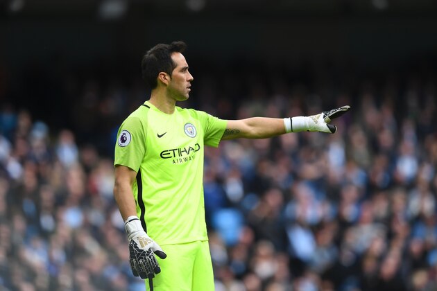 Manchester City's Chilean goalkeeper Claudio Bravo gestures during the English Premier League football match between Manchester City and Southampton at the Etihad Stadium in Manchester, north west England, on October 23, 2016. / AFP / Paul ELLIS / RESTRICTED TO EDITORIAL USE. No use with unauthorized audio, video, data, fixture lists, club/league logos or 'live' services. Online in-match use limited to 75 images, no video emulation. No use in betting, games or single club/league/player publications.  /         (Photo credit should read PAUL ELLIS/AFP/Getty Images)