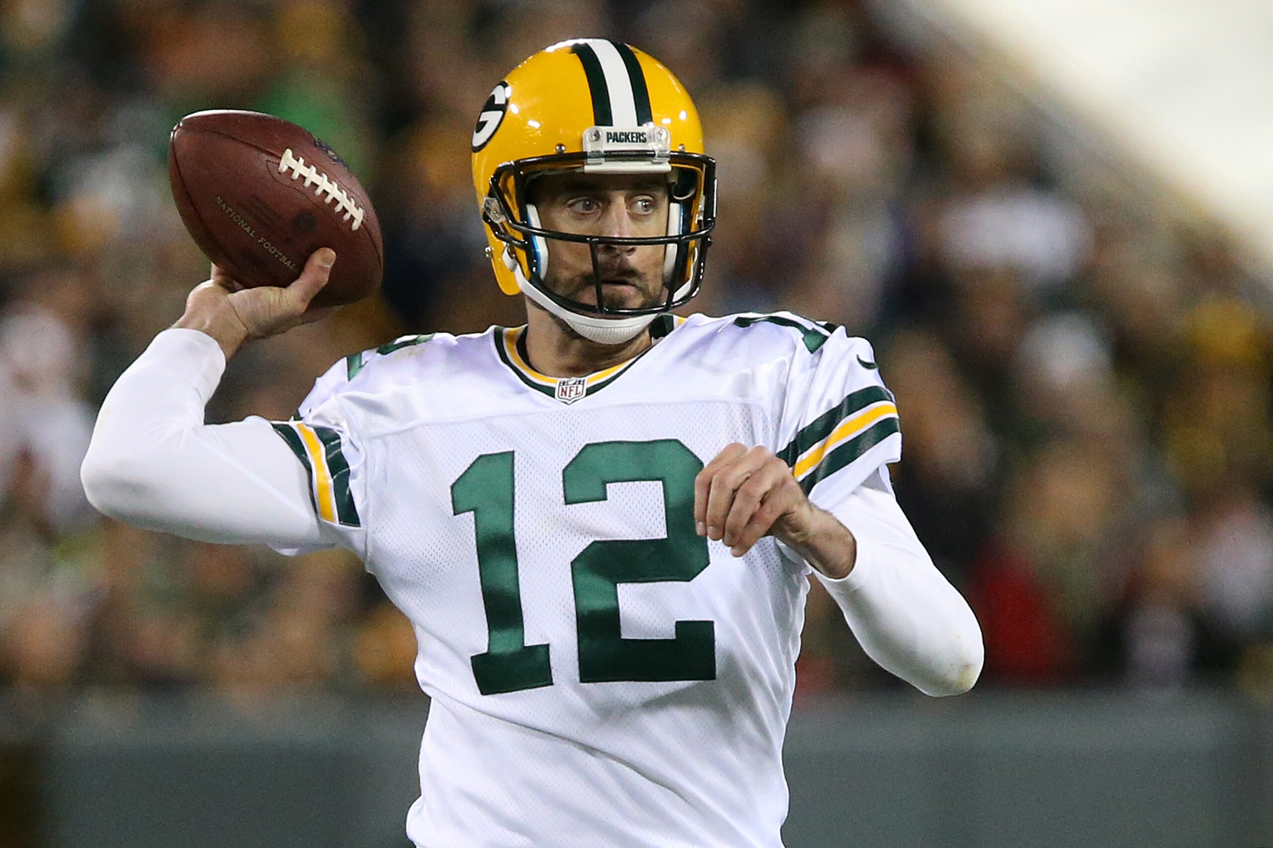 GREENBAY, WI - OCTOBER 20: Quarterback Aaron Rodgers #12 of the Green Bay Packers passes the ball against the Chicago Bears in the first quarter at Lambeau Field on October 20, 2016 in Green Bay, Wisconsin. (Photo by Dylan Buell/Getty Images)