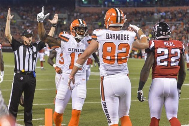 Cleveland Browns tight end Gary Barnidge (82) celebrates with wide receiver Terrelle Pryor, center left, after scoring a touchdown in the first half of an NFL preseason football game against the Atlanta Falcons, Thursday, Aug. 18, 2016, in Cleveland. (AP Photo/David Richard)