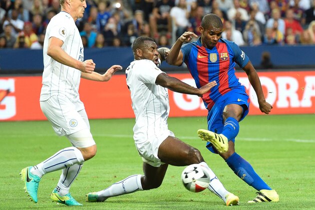 Barcelona's Brazilian defender Marlon Santos (R) vies with Leicester's English defender Danny Simpson (C) during the 2016 International Champions Cup friendly football match between FC Barcelona and Leicester City at Friends Arena on August 3, 2016 in Solna, Sweden. / AFP / JONATHAN NACKSTRAND        (Photo credit should read JONATHAN NACKSTRAND/AFP/Getty Images)