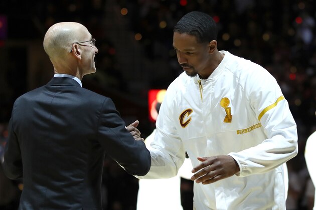 CLEVELAND, OH - OCTOBER 25:  Channing Frye #8 of the Cleveland Cavaliers speaks to NBA Commissioner Adam Silver as he receives his championship ring before a game against the New York Knicks at Quicken Loans Arena on October 25, 2016 in Cleveland, Ohio.   NOTE TO USER: User expressly acknowledges and agrees that, by downloading and or using this photograph, User is consenting to the terms and conditions of the Getty Images License Agreement. (Photo by Ezra Shaw/Getty Images)