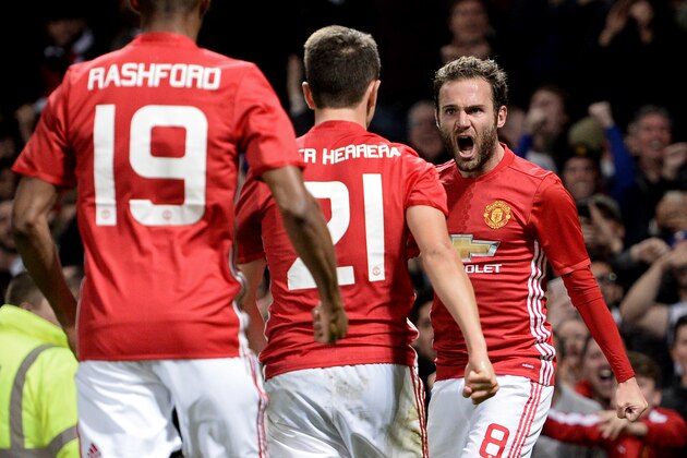 Manchester United's Spanish midfielder Juan Mata (R) celebrates with teammates after scoring the opening goal of the EFL (English Football League) Cup fourth round match between Manchester United and Manchester City at Old Trafford in Manchester, north west England on October 26, 2016. / AFP / Oli SCARFF / RESTRICTED TO EDITORIAL USE. No use with unauthorized audio, video, data, fixture lists, club/league logos or 'live' services. Online in-match use limited to 75 images, no video emulation. No use in betting, games or single club/league/player publications.  /         (Photo credit should read OLI SCARFF/AFP/Getty Images)